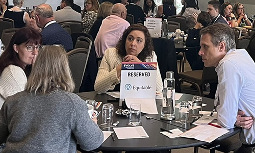 Group talking at a sponsored table.