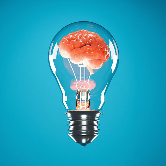 A light bulb with a brain inside of it