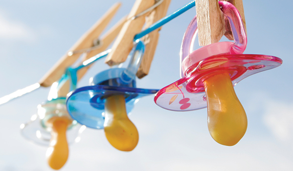 Pacifiers hanging on a clothesline