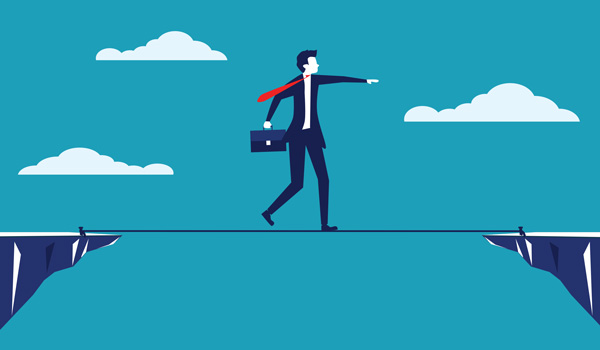Illustration of a businessman walking on a tightrope
